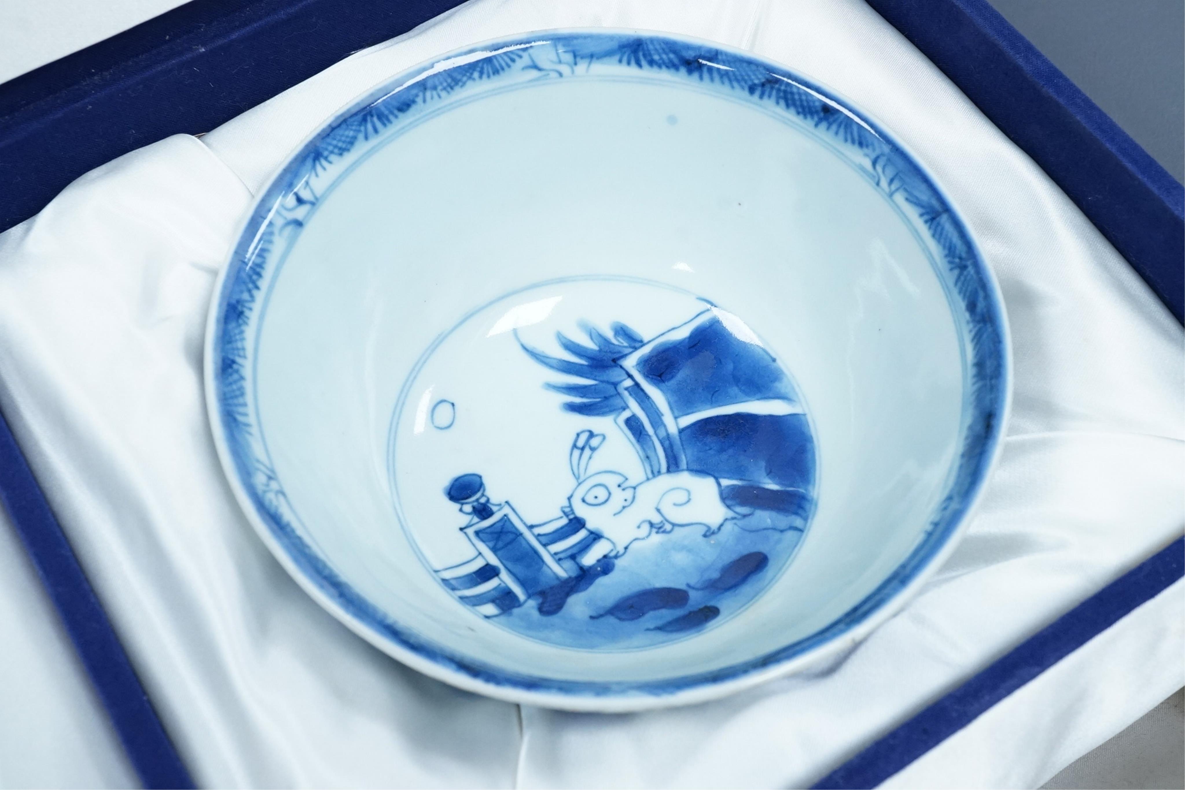 A pair of Chinese Transitional blue and white 'mythical beasts' bowls, early Kangxi period